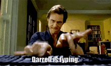 a man is typing on a keyboard with the words darren is typing below him