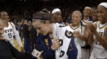 a group of female basketball players including number 15