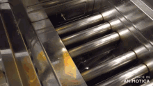 a stainless steel container with the words made in animotica written on the bottom