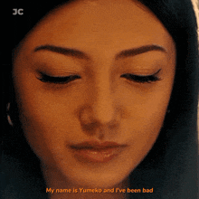 a close up of a woman 's face with the words my name is yumeko and i 've been bad