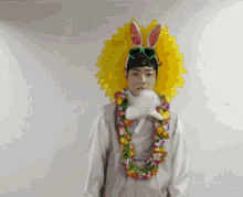 a man wearing a bunny hat and a flower lei