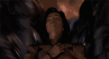 a woman laying down with her eyes closed and her hands on her chest