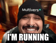 a man wearing a hat that says multivers x is running
