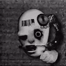 a black and white photo of a person 's face with a ring around it .