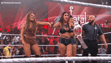 two women in a wrestling ring with the hashtag thekamdreesen on the bottom right