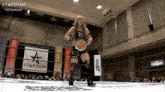 a woman in a wrestling ring with a banner that says stardom on it
