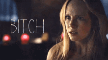 a close up of a woman 's face with the word bitch written above her