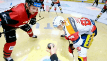 a hockey player wearing a jersey that says ' stout ' on it