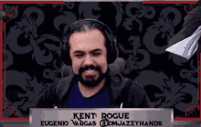 a man wearing headphones and a sign that says kent rogue on it