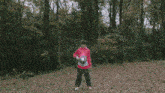 a person in a red jacket is surrounded by a bubble of light