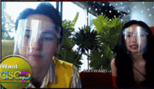 a man and a woman wearing face shields are on a screen that says " want asc "
