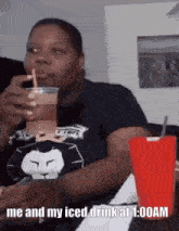 a woman is drinking an iced drink at 1:00 am .