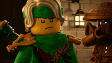 a lego figure with a green scarf around his head