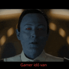 a close up of a man 's face with red eyes and the words gamer ido van below him