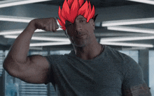 a man flexes his muscles with a drawing of a red haired character on his head