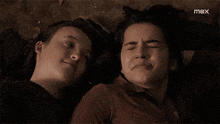 a couple of girls laying next to each other with max written on the bottom of the screen