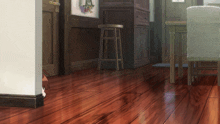 a wooden floor in a room with a stool on it