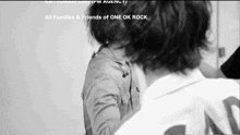 a black and white photo with the words all families and friends of one ok rock on the bottom