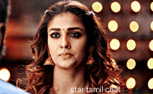 a close up of a woman 's face with the words star tamil chat written below her