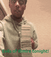 a man holding a stack of money with the words evils of illumina tonight on the bottom