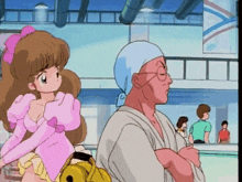 a man and a girl are standing next to each other in a room