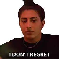 a woman says i don 't regret while wearing a black shirt