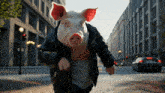 a pig wearing a black jacket is running down a city street