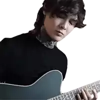 a man is playing a guitar with his eyes closed