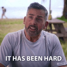 a man with a beard and a white shirt says it has been hard