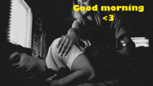 a black and white photo of a man and woman with the words good morning < 3