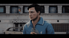 a man wearing a blue jacket with the letter f on the front