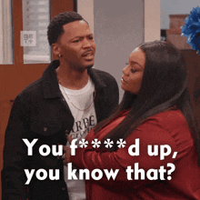 a man and a woman are standing next to each other and the woman is asking the man if he knows that