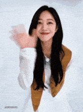 a woman with long black hair is smiling and waving her hand in front of a white background that says jungmyeon