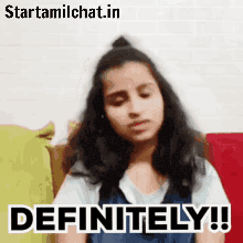 a girl is sitting on a couch with her eyes closed and the words `` definitely '' written on her face .