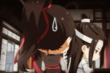 a girl with a teardrop on her head is standing next to another girl