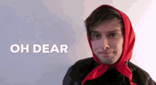 a man wearing a red scarf around his head with the words oh dear above him