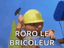 bob the builder is wearing a hard hat and holding a hammer and says " roro le bricoleur "