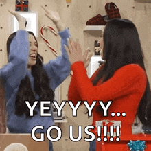 two women giving each other a high five with the words yeyyy go us !!!
