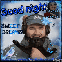a man wearing headphones holds a black cat with the words good night sweet dreams