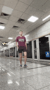 a man wearing a t-shirt that says ' nigglecat ' on it