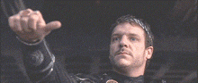a man with a laurel wreath on his head is pointing up