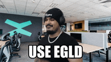 a man wearing headphones says use egld