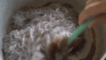 Mixing The Noodles And Sauce Two Plaid Aprons GIF - Mixing The Noodles And Sauce Two Plaid Aprons Stirring GIFs