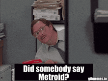 a man with glasses and a mustache is behind a sign that says did somebody say metroid ?