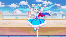 a girl in a blue and white dress is dancing on a rooftop .