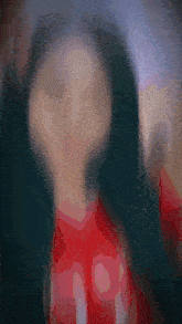 a blurry picture of a woman with long hair