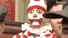 a man in a clown costume with sonnyc on the bottom right