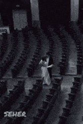 a blurry picture of a dark background with a few white squares in it