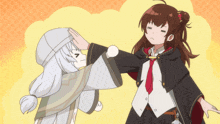 a girl in a black cape is putting her hand on another girl 's head