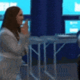 a blurry image of a woman talking on a phone